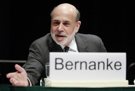 Federal Reserve Chairman Ben Bernanke leans forward to speak with someone before addressing the Economic Club of Indiana in Indianapolis Oct Federal Reserve Chairman Ben Bernanke leans forward to speak with someone before addressing the Economic Club of Indiana in Indianapolis Oct