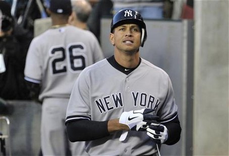 New York Yankees' Alex Rodriguez reacts after returning to the dugout after his first at-bat in the sixth inning during Game 4 of the MLB AL New York Yankees' Alex Rodriguez reacts after returning to the dugout after his first at-bat in the sixth inning during Game 4 of the MLB AL