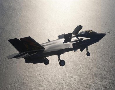 A F-35 fighter jet prepares for landing with its life fan cover deployed over Patuxent River Naval Air Station, Maryland in this undated han A F-35 fighter jet prepares for landing with its life fan cover deployed over Patuxent River Naval Air Station, Maryland in this undated han