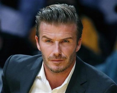 British soccer star David Beckham sits courtside as the Los Angeles Lakers play the Dallas Mavericks during their NBA basketball game in Los British soccer star David Beckham sits courtside as the Los Angeles Lakers play the Dallas Mavericks during their NBA basketball game in Los