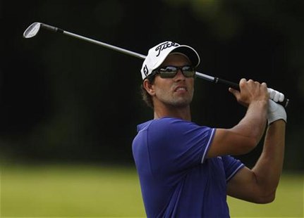 Adam Scott of Australia hits a shot on the 10th hole during the third round of the Barclays Singapore Open golf tournament in Sentosa Novemb Adam Scott of Australia hits a shot on the 10th hole during the third round of the Barclays Singapore Open golf tournament in Sentosa Novemb