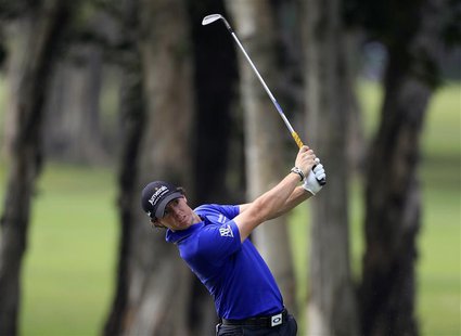 Rory McIlroy from Northern Ireland hits a shot on the sixth fairway during the second day of the Hong Kong Open Championship November 16, 20 Rory McIlroy from Northern Ireland hits a shot on the sixth fairway during the second day of the Hong Kong Open Championship November 16, 20