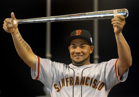 National League All-Star Melky Cabrera of the San Francisco Giants holds the MVP trophy after the National defeated the American League in M National League All-Star Melky Cabrera of the San Francisco Giants holds the MVP trophy after the National defeated the American League in M