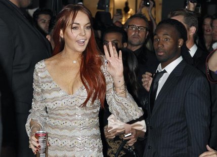 Actress Lindsay Lohan waves as she arrives for the Mr. Pink Ginseng Drink launch party at the Beverly Wilshire Hotel in Beverly Hills, Calif Actress Lindsay Lohan waves as she arrives for the Mr. Pink Ginseng Drink launch party at the Beverly Wilshire Hotel in Beverly Hills, Calif