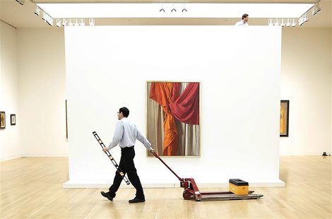 REFILE - ADDITIONAL CAPTION INFORMATION Workers put together the displays for the Sotheby's Latin American Art auction, in front of the arti REFILE - ADDITIONAL CAPTION INFORMATION Workers put together the displays for the Sotheby's Latin American Art auction, in front of the arti