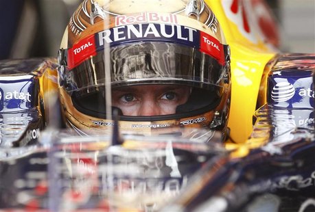 Red Bull Formula One driver Sebastian Vettel of Germany sits in his car during the second practice session of the U.S. F1 Grand Prix at the Red Bull Formula One driver Sebastian Vettel of Germany sits in his car during the second practice session of the U.S. F1 Grand Prix at the