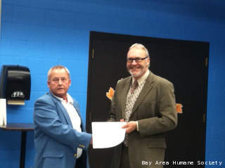 Clyde Truttman presents a $342,627 donation to the Bay Area Humane Society on behalf of Angus and Norma Beaton, Nov. 16, 2012. (courtesy of FOX 11). Clyde Truttman presents a $342,627 donation to the Bay Area Humane Society on behalf of Angus and Norma Beaton, Nov. 16, 2012. (courtesy of FOX 11).