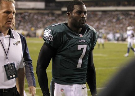 Philadelphia Eagles quarterback Michael Vick leaves the field with a concussion while playing against the Dallas Cowboys during the second q Philadelphia Eagles quarterback Michael Vick leaves the field with a concussion while playing against the Dallas Cowboys during the second q