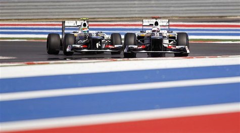 Sauber Formula One driver Kamui Kobayashi (R) of Japan drives ahead of team mate Sergio Perez of Mexico during the second practice session o Sauber Formula One driver Kamui Kobayashi (R) of Japan drives ahead of team mate Sergio Perez of Mexico during the second practice session o