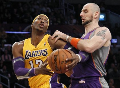 Phoenix Suns' Marcin Gortat (R) of Poland defends against Los Angeles Lakers' Dwight Howard during the first half of their NBA basketball ga Phoenix Suns' Marcin Gortat (R) of Poland defends against Los Angeles Lakers' Dwight Howard during the first half of their NBA basketball ga