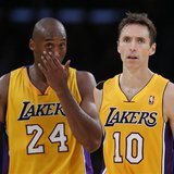 Los Angeles Lakers Steve Nash of Canada (R) and Kobe Bryant react during their loss to the Dallas Mavericks during their NBA basketball game