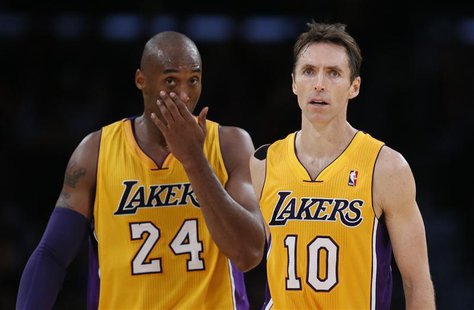 Los Angeles Lakers Steve Nash of Canada (R) and Kobe Bryant react during their loss to the Dallas Mavericks during their NBA basketball game Los Angeles Lakers Steve Nash of Canada (R) and Kobe Bryant react during their loss to the Dallas Mavericks during their NBA basketball game