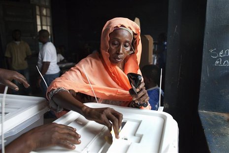 A woman casts her ballot during presidential elections in Freetown, Sierra Leone November 17, 2012. REUTERS/Joe Penny A woman casts her ballot during presidential elections in Freetown, Sierra Leone November 17, 2012. REUTERS/Joe Penny