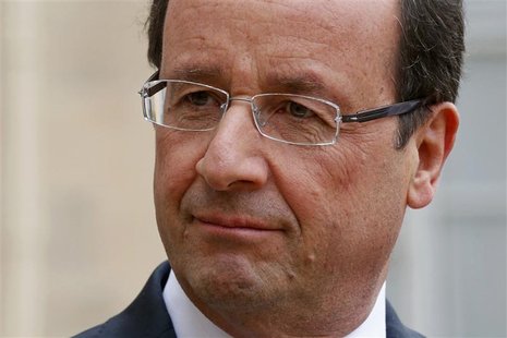 France's President Francois Hollande listens as a guest speaks in the courtyard following a meeting at the Elysee Palace in Paris, November France's President Francois Hollande listens as a guest speaks in the courtyard following a meeting at the Elysee Palace in Paris, November