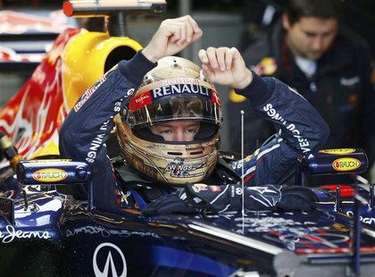 Red Bull Formula One driver Sebastian Vettel of Germany sits in his car during the third practice session of the U.S. F1 Grand Prix at the C Red Bull Formula One driver Sebastian Vettel of Germany sits in his car during the third practice session of the U.S. F1 Grand Prix at the C