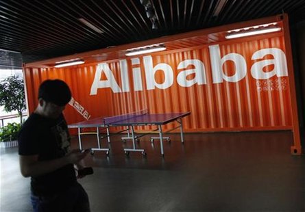 An employee walks past a logo of Alibaba (China) Technology Co. Ltd during a media tour organised by government officials at its headquarter An employee walks past a logo of Alibaba (China) Technology Co. Ltd during a media tour organised by government officials at its headquarter