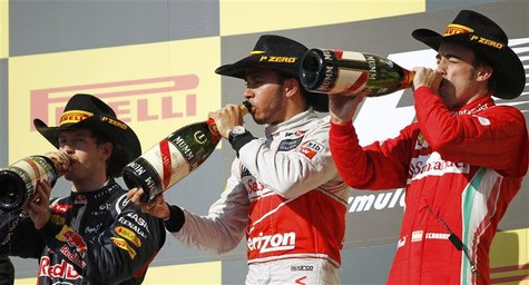 McLaren Formula One driver Lewis Hamilton of Britain, Red Bull Formula One driver Sebastian Vettel (L) of Germany and Ferrari Formula One dr McLaren Formula One driver Lewis Hamilton of Britain, Red Bull Formula One driver Sebastian Vettel (L) of Germany and Ferrari Formula One dr