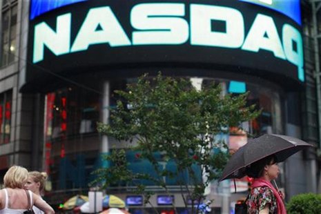 People walk outside the Nasdaq Market site in New York's Times Square, July 23, 2012. REUTERS/Brendan McDermid People walk outside the Nasdaq Market site in New York's Times Square, July 23, 2012. REUTERS/Brendan McDermid