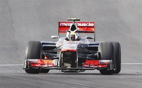 McLaren Formula One driver Lewis Hamilton of Britain celebrates after crossing the finish line to win the U.S. F1 Grand Prix at the Circuit McLaren Formula One driver Lewis Hamilton of Britain celebrates after crossing the finish line to win the U.S. F1 Grand Prix at the Circuit
