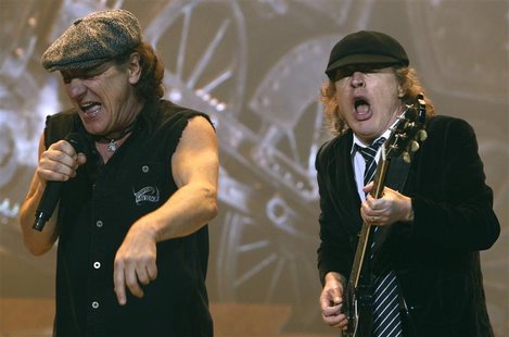 AC/DC lead vocalist Brian Johnson (L) and Angus Young performs at the O2 Millennium Dome stadium in London April 14, 2009. REUTERS/Luke MacG AC/DC lead vocalist Brian Johnson (L) and Angus Young performs at the O2 Millennium Dome stadium in London April 14, 2009. REUTERS/Luke MacG
