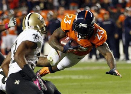 Denver Broncos running back Willis McGahee (23) flies to the 1-yard-line past New Orleans Saints cornerback Jabari Greer (L) in the first qu Denver Broncos running back Willis McGahee (23) flies to the 1-yard-line past New Orleans Saints cornerback Jabari Greer (L) in the first qu