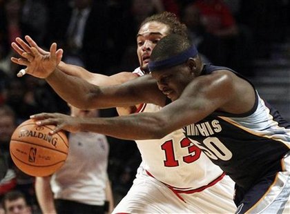 Memphis Grizzlies' Zach Randolph (front) and Chicago Bulls' Joakim Noah chase down the ball during the first quarter of their NBA pre-season Memphis Grizzlies' Zach Randolph (front) and Chicago Bulls' Joakim Noah chase down the ball during the first quarter of their NBA pre-season