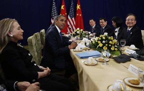 U.S. President Barack Obama (2nd L) meets with Chinese Premier Wen Jiabao (R), as U.S. Secretary of State Hillary Clinton (L) looks on, at t U.S. President Barack Obama (2nd L) meets with Chinese Premier Wen Jiabao (R), as U.S. Secretary of State Hillary Clinton (L) looks on, at t