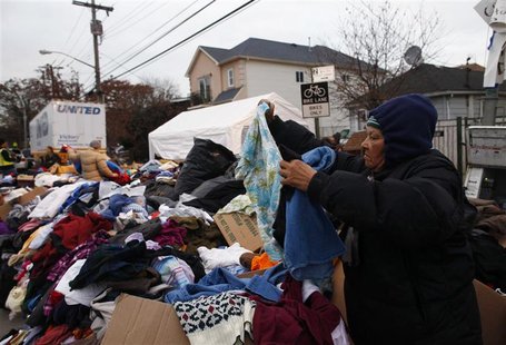 A woman searches through clothing donated to Hurricane Sandy victims in the Staten Island borough of New York November 19, 2012. REUTERS/Eri A woman searches through clothing donated to Hurricane Sandy victims in the Staten Island borough of New York November 19, 2012. REUTERS/Eri
