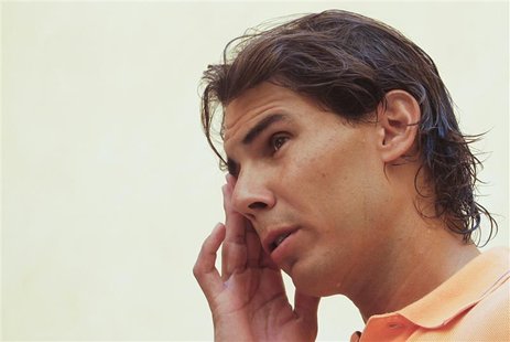 Spain's Rafael Nadal gestures between television interviews, during which he detailed reasons for pulling out of the U.S. Open, in Palma de Spain's Rafael Nadal gestures between television interviews, during which he detailed reasons for pulling out of the U.S. Open, in Palma de