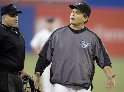 Toronto Blue Jays manager John Gibbons (R) stands on the field during their MLB baseball game against the New York Yankees in Toronto May 31 Toronto Blue Jays manager John Gibbons (R) stands on the field during their MLB baseball game against the New York Yankees in Toronto May 31