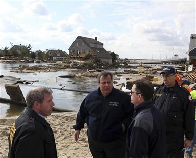 Governor Chris Christie (2nd L) surveys the Hurricane Sandy damaged areas along Rt 35 in Bayhead, New Jersey, November 2, 2012 in this hando Governor Chris Christie (2nd L) surveys the Hurricane Sandy damaged areas along Rt 35 in Bayhead, New Jersey, November 2, 2012 in this hando