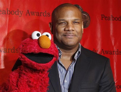 Voice actor Kevin Clash arrives with the puppet Elmo for the 2010 Peabody Award ceremony at the Waldorf Astoria in New York in this May 17, Voice actor Kevin Clash arrives with the puppet Elmo for the 2010 Peabody Award ceremony at the Waldorf Astoria in New York in this May 17,
