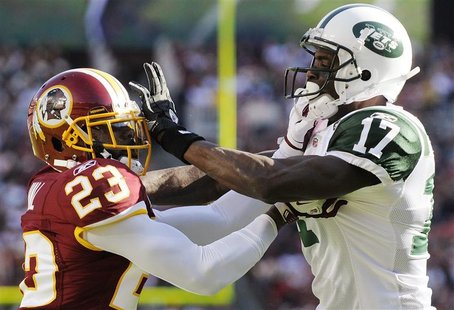 Washington Redskins cornerback DeAngelo Hall (L) and receiver Plaxico Burress continue to go at each other after the whistle at the end of a Washington Redskins cornerback DeAngelo Hall (L) and receiver Plaxico Burress continue to go at each other after the whistle at the end of a