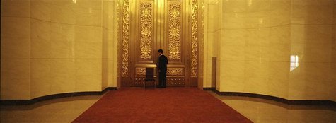 A security person closes a door as he guards an area of the Great Hall of the People, the venue of the 18th National Congress of the Communi A security person closes a door as he guards an area of the Great Hall of the People, the venue of the 18th National Congress of the Communi
