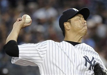 New York Yankees starting pitcher Hiroki Kuroda throws a pitch to the Boston Red Sox in the first inning of their MLB American League game a New York Yankees starting pitcher Hiroki Kuroda throws a pitch to the Boston Red Sox in the first inning of their MLB American League game a