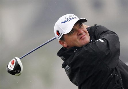 Paul Lawrie of Scotland tees off on the first hole during the BMW Masters 2012 golf tournament at Lake Malaren Golf Club in Shanghai October Paul Lawrie of Scotland tees off on the first hole during the BMW Masters 2012 golf tournament at Lake Malaren Golf Club in Shanghai October