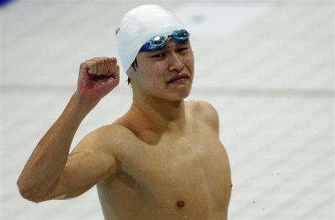 China's Sun Yang reacts after winning the gold in the men's 1500m freestyle final with a world record during the London 2012 Olympic Games a China's Sun Yang reacts after winning the gold in the men's 1500m freestyle final with a world record during the London 2012 Olympic Games a