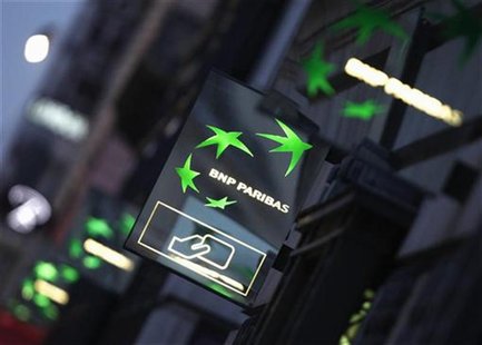 Illuminated signs light up at twilight outside the headquarters of the BNP Paribas bank in Paris January 30, 2012. REUTERS/Mal Langsdon Illuminated signs light up at twilight outside the headquarters of the BNP Paribas bank in Paris January 30, 2012. REUTERS/Mal Langsdon