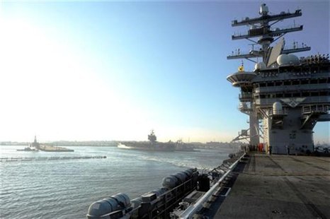 The aircraft carrier USS Dwight D. Eisenhower departs Naval Station Norfolk in this file photo taken August 25, 2011. REUTERS/Mass Communica The aircraft carrier USS Dwight D. Eisenhower departs Naval Station Norfolk in this file photo taken August 25, 2011. REUTERS/Mass Communica