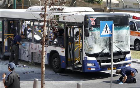 Israeli police survey the scene after an explosion on a bus in Tel Aviv November 21, 2012. Credit: REUTERS/Nir Elias Israeli police survey the scene after an explosion on a bus in Tel Aviv November 21, 2012. Credit: REUTERS/Nir Elias
