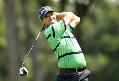 Padraig Harrington of Ireland watches his tee shot on the 12th hole during the second round of the Barclays PGA golf tournament on the Black Padraig Harrington of Ireland watches his tee shot on the 12th hole during the second round of the Barclays PGA golf tournament on the Black