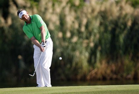 Luke Donald of England hits a shot onto the 17th green during the first round of the DP World Tour Championship at Jumeirah Golf Estates in Luke Donald of England hits a shot onto the 17th green during the first round of the DP World Tour Championship at Jumeirah Golf Estates in