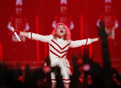 Singer Madonna performs at Staples Center as part of her MDNA world tour in Los Angeles, California October 10, 2012. REUTERS/Mario Anzuoni Singer Madonna performs at Staples Center as part of her MDNA world tour in Los Angeles, California October 10, 2012. REUTERS/Mario Anzuoni