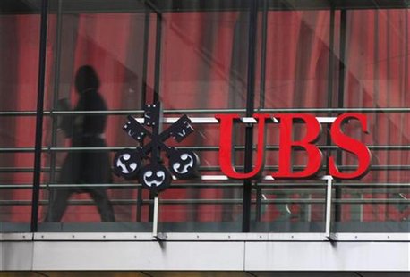 A woman walks past a logo of Swiss bank UBS at a building in Zurich November 13, 2012. REUTERS/Michael Buholzer A woman walks past a logo of Swiss bank UBS at a building in Zurich November 13, 2012. REUTERS/Michael Buholzer