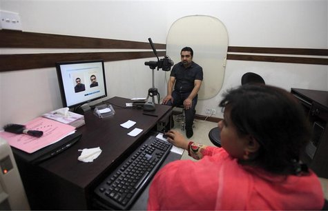 A citizen is photographed during registration for the government identity card at the National Database and Registration Authority (NADRA) o A citizen is photographed during registration for the government identity card at the National Database and Registration Authority (NADRA) o