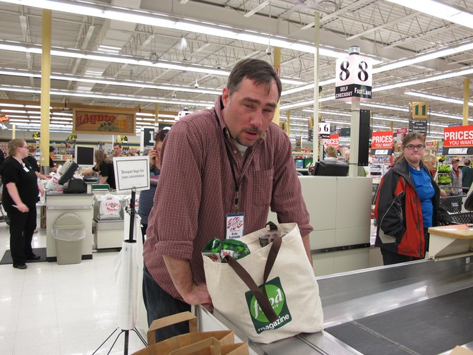 Eric...whew...he's now been baggin' groceries for 57 straight hours!! One of our super cool marketing reps..!!