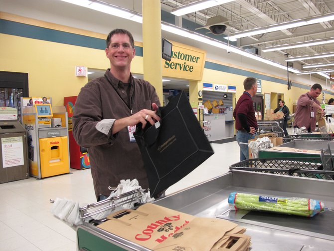 Joel..one of our big time marketing reps baggin' groceries..Go Joel!