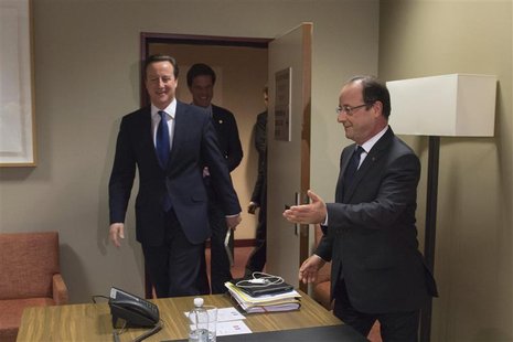French President Francois Hollande (R) arrives with Britain's Prime Minister David Cameron (L) and the Netherlands' Prime Minister Mark Rutt French President Francois Hollande (R) arrives with Britain's Prime Minister David Cameron (L) and the Netherlands' Prime Minister Mark Rutt