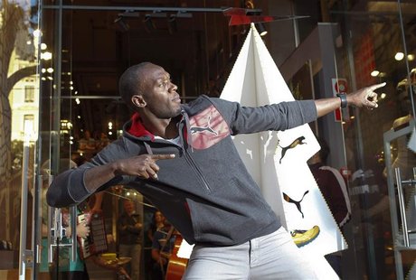 Jamaica's double Olympic champion sprinter Usain Bolt stikes a pose while inaugurating a Puma store in Barcelona November 23, 2012. REUTERS/ Jamaica's double Olympic champion sprinter Usain Bolt stikes a pose while inaugurating a Puma store in Barcelona November 23, 2012. REUTERS/