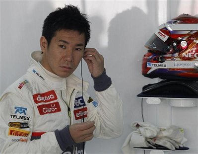Sauber Formula One driver Kamui Kobayashi of Japan gets ready for the first practice session of the Indian F1 Grand Prix at the Buddh Intern Sauber Formula One driver Kamui Kobayashi of Japan gets ready for the first practice session of the Indian F1 Grand Prix at the Buddh Intern